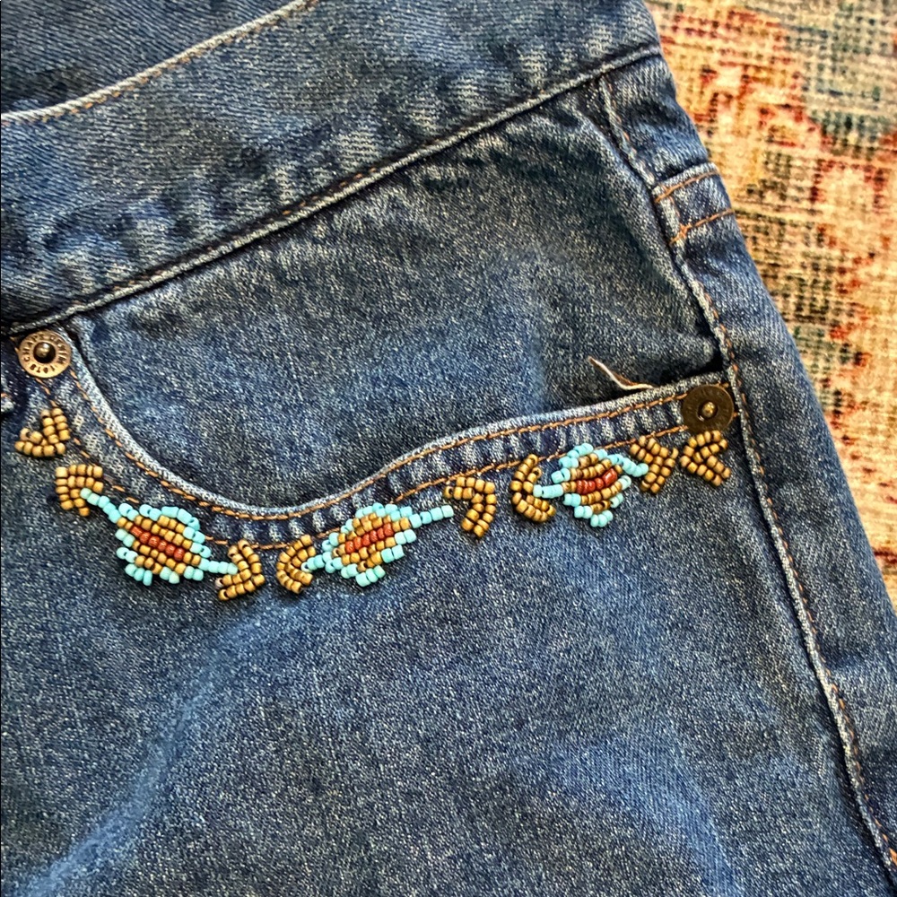 Jeans with turquoise beads on front pockets size 16